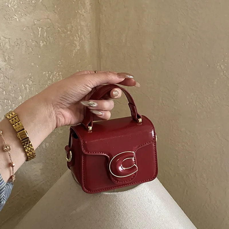 Mini Structured Top Handle Bag with Embossed Logo Detail